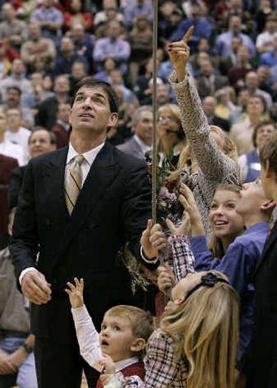 
John Stockton has help from family Monday night in Salt Lake City, pulling a rope to reveal his retired Utah Jazz jersey hanging in the Delta Center. 
 (Associated Press / The Spokesman-Review)