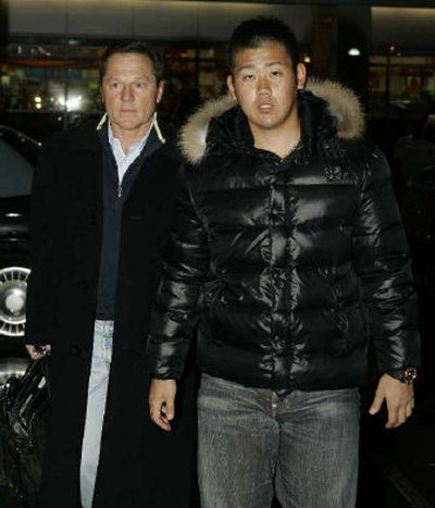 
 Daisuke Matsuzaka, right, arrives with his agent Scott Boras for a physical in Boston. 
 (Associated Press / The Spokesman-Review)