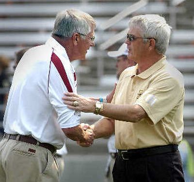 
Dennis Erickson, right, with WSU coach Bill Doba, remains a candidate at ASU.
 (Christopher Anderson / The Spokesman-Review)