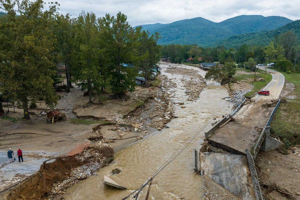 Hurricane Helene washed out a bridge on Highway 22 in North Cove, N.C.   (Julia Wall/For The Washington Post)