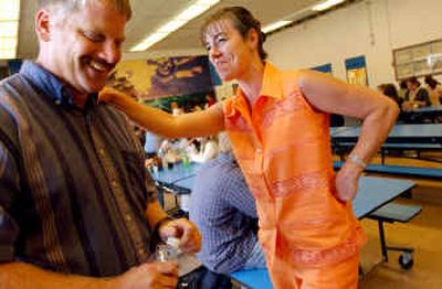 
Conrad Garner endures a little teasing from co-worker Wendy Seley on Wednesday, about being named State Teacher of the Year by Phi Delta Kappa International. 
 (Kathy Plonka / The Spokesman-Review)