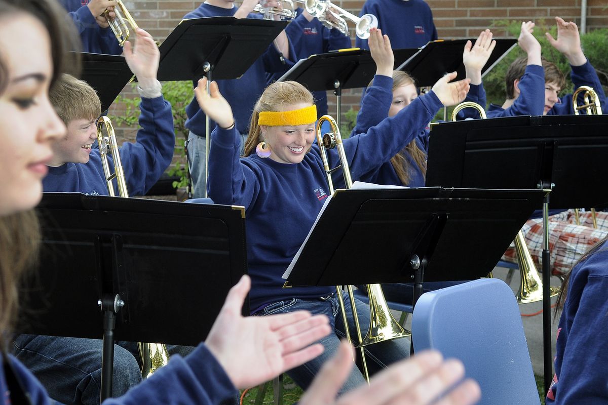 Savanna Jenkins, wearing headband, and members of the Ferris High School Jazz Orchestra perform “Birdland” during the school’s renovation groundbreaking ceremony Wednesday. The modernization was officially kicked off with a completion date by fall 2014. (Dan Pelle)
