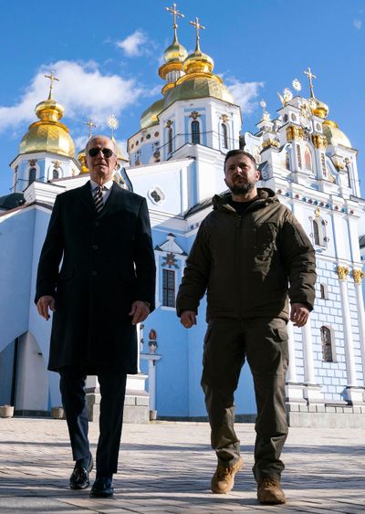U.S. President Joe Biden (left) walks with Ukrainian President Volodymyr Zelensky (right) in front of St. Michael's Golden-Domed Cathedral during an unannounced visit, in Kyiv, on Monday, Feb. 20, 2023. (Evan Vucci/Pool/AFP/Getty Images/TNS)  (EVAN VUCCI/AFP/Getty Images North America/TNS)