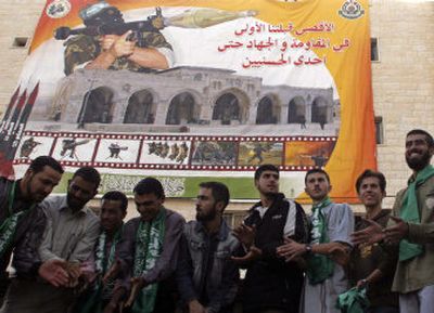 
Palestinian Hamas supporters dance in the West Bank town of Jenin during a rally in support of a Palestinian unity government on Monday. 
 (Associated Press / The Spokesman-Review)