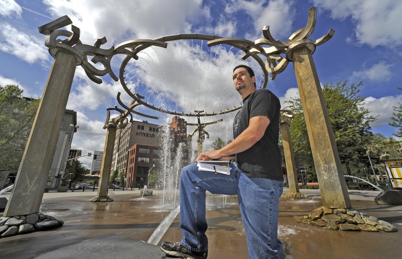 Adrian B. Shannon is framed by the Rotary Fountain in downtown Spokane earlier this month. He is among a growing number of people who question the legitimacy of federal, state and local government agencies. (Christopher Anderson)