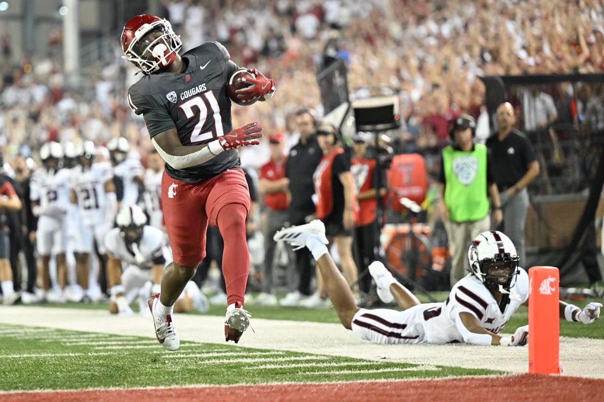 Washington State Cougars running back Wayshawn Parker (21) runs the ball in for a touchdown agianst the Texas Tech Red Raiders during the first half of a college football game on Saturday, Sep. 7, 2024, at Gesa Field in Pullman, Wash. WSU led 27-10 at the half.  (Tyler Tjomsland/The Spokesman-Review)