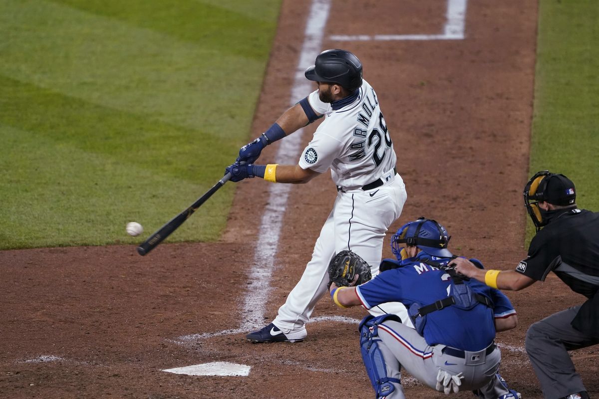 The Mariners’ Jose Marmolejos hits a single to score Kyle Seager with the go-ahead run in the eighth inning Friday in Seattle.  (Associated Press)