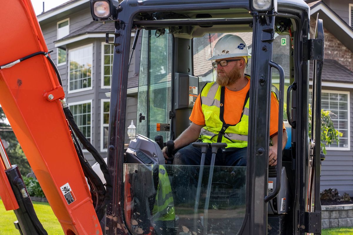 A TDS associate helps prepare the ground to lay fiber-optic cable in the Five Mile area. TDS is building an all-fiber, high-speed internet network in Spokane, with service available in many neighborhoods and more to come. (Courtesy  TDS)