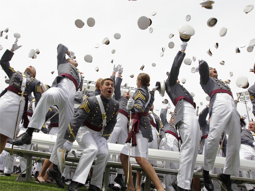Graduates of the U.S. Military Academy in West Point, N.Y., celebrate, Saturday, May 22, 2010. (J. Applewhite / Associated Press)