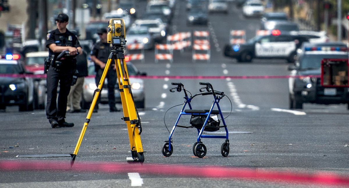The pedestrian using this walker was struck and killed near a crosswalk in Division Street at Third Avenue just after 10 a.m. Spokane Monday morning. (Kathy Plonka / The Spokesman-Review)