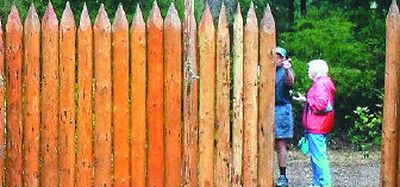 The ends of the logs on the original replica of Fort Clatsop built in 1955 were cut off square with saws. Builders roughed up the wood and chopped off points on the new replica to make it look more authentic.
(Seattle Times / The Spokesman-Review)