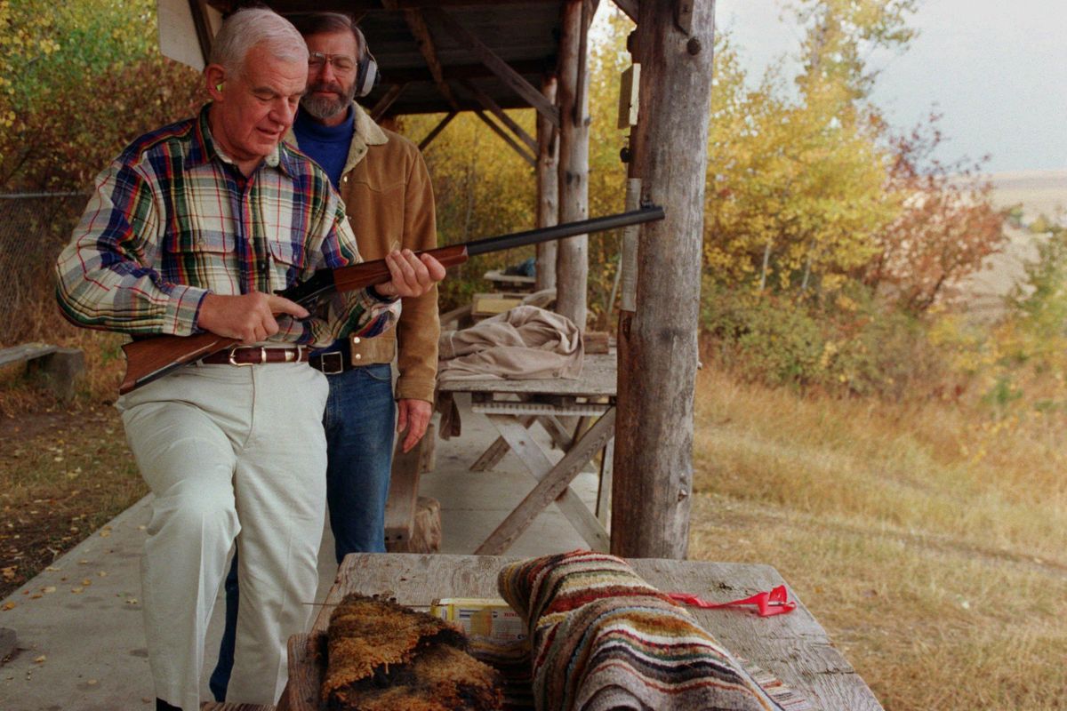 Tom Foley gets some tips from Ron Racek as Foley prepares to shoot Racek’s 45/70 buffalo gun at the Spokane Valley Rifle and Pistol Range outside Mica on Wednesday, Oct. 23, 1994. Foley met with club members in an attempt to counter negative NRA ads. (Sandra Bancroft-Billings / SR)
