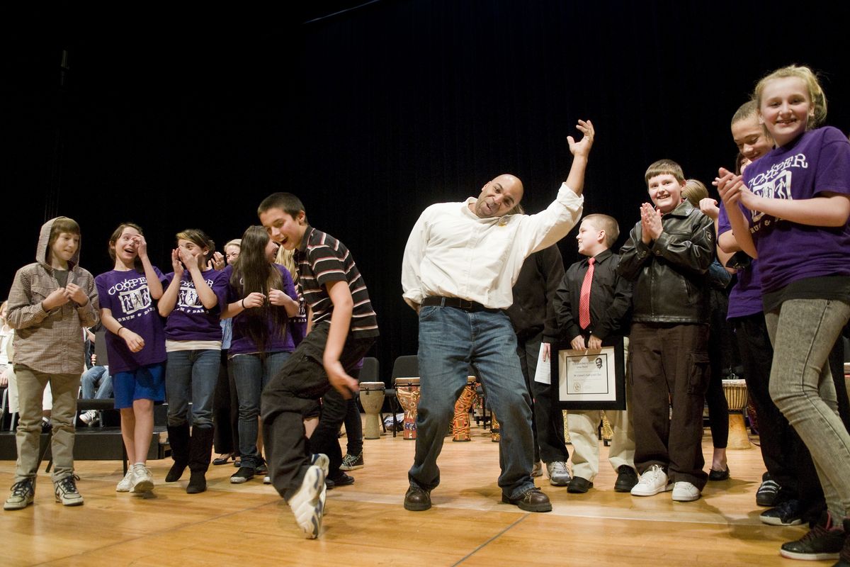 Cooper Elementary School sixth-grade teacher David Casteal celebrates on stage with his students after they won the Diversity Elementary School Group Award Thursday during the Chase Youth Awards ceremony at The Fox. (Colin Mulvany)