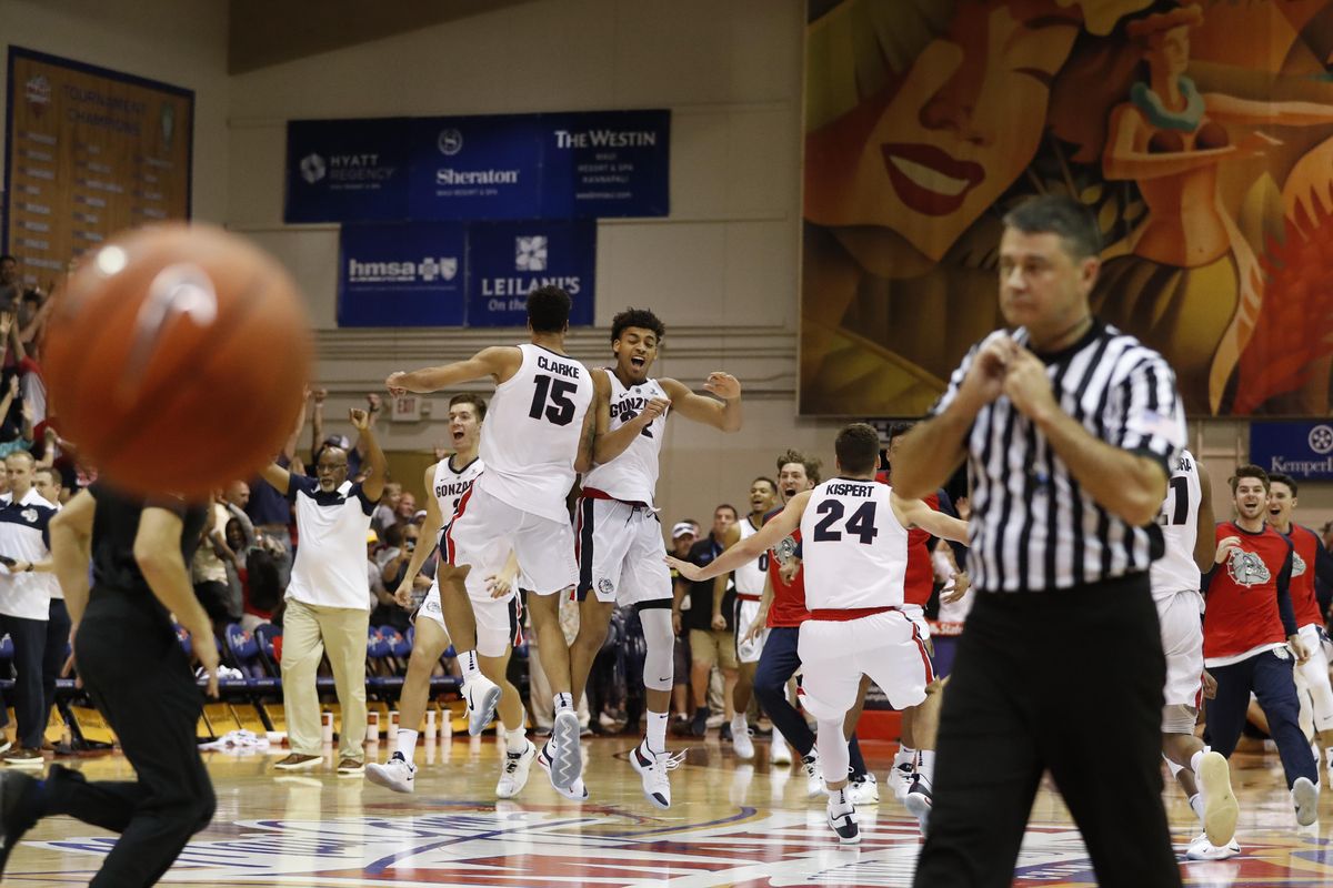 Forwards Brandon Clarke and forward Jeremy Jones celebrate at midcourt after Gonzaga defeated Duke 89-87 to win the Maui Invitational. (MARCO GARCIA / AP)