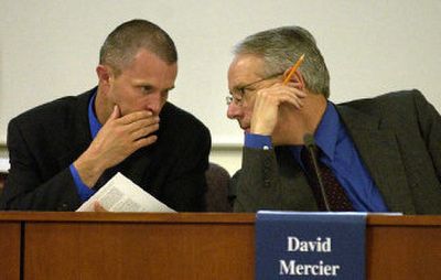 
Deputy City Attorney Cary Driskell, left, and City Manager David Mercier confer during a Spokane Valley City Council meeting last year. 
 (File / The Spokesman-Review)