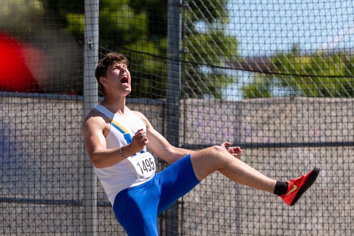Mead junior Simon Rosselli lets out a scream after a meet-record toss in the State 4A boys discus on Friday at Mount Tahoma High School in Tacoma. (Joshua Hart/For Spokesman-Review)
