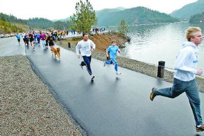
Phil Howard, 17, leads during  Mentor Miles, a run to raise money for the Kootenai County Juvenile Justice Services Mentoring Program. The run, held Saturday at Higgens Point on Lake Coeur d'Alene, drew about 100 runners. Howard was the winner. 
 (Jesse Tinsley / The Spokesman-Review)