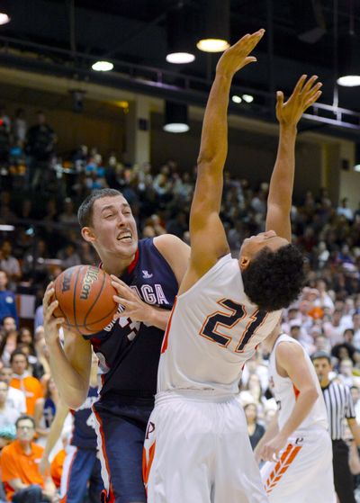 Gonzaga forward Kyle Wiltjer, left, collides with Waves guard Shawn Olden as he drives to the basket. (Associated Press)