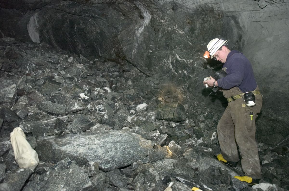 Kevin Torpy, of Coeur d’Alene Mines Corp., studies rocks in the tunnel coming from the Comet Mine side of the Kensington Mine in Alaska in February 2007.  (File Associated Press / The Spokesman-Review)
