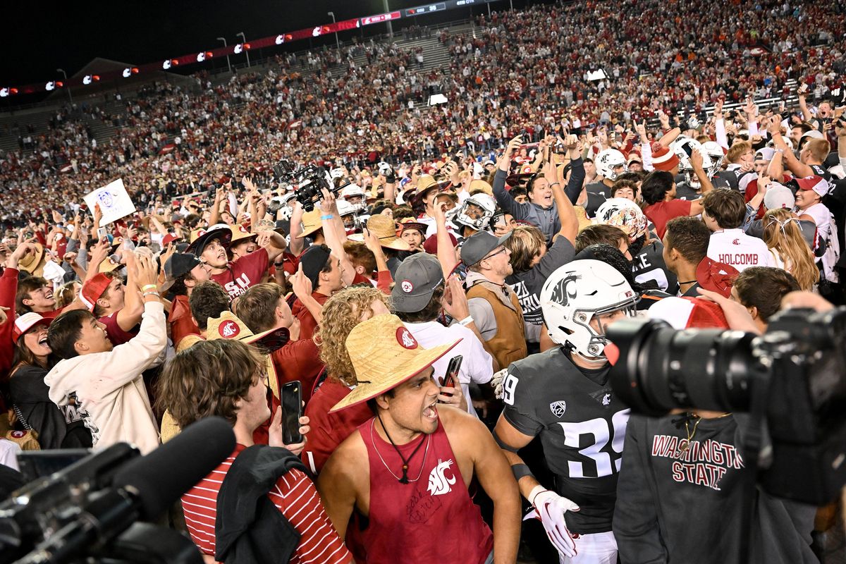 WSU fans storm Gesa Field after WSU defeated the Oregon State Beavers during the second half of a college football game on Saturday, Sept. 23, 2023, at Martin Stadium in Pullman, Wash. WSU won the game 38-35.  (Tyler Tjomsland/The Spokesman-Review)