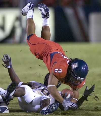 Arizona’s Keola Antolin rushed for 149 yards and three touchdowns.  (Associated Press / The Spokesman-Review)