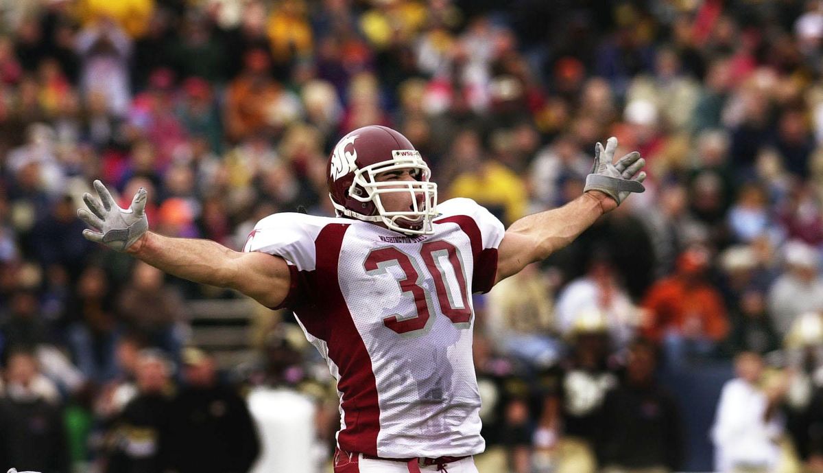 Washington State’s Raonall Smith expresses himself to the WSU faithful after sacking Purdue quarterback Kyle Orton in the first half of the Sun Bowl NCAA football game on Monday, Dec. 31, 2001 in El Paso, Texas. (Christopher Anderson / The Spokesman-Review)