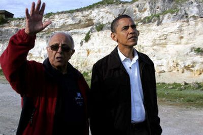 
Barack Obama, right, is escorted by former Robben Island prisoner Achmat Kathrada at the lime quarry on Robben Island, off the coast of Cape Town, South Africa, on Sunday. 
 (Associated Press / The Spokesman-Review)