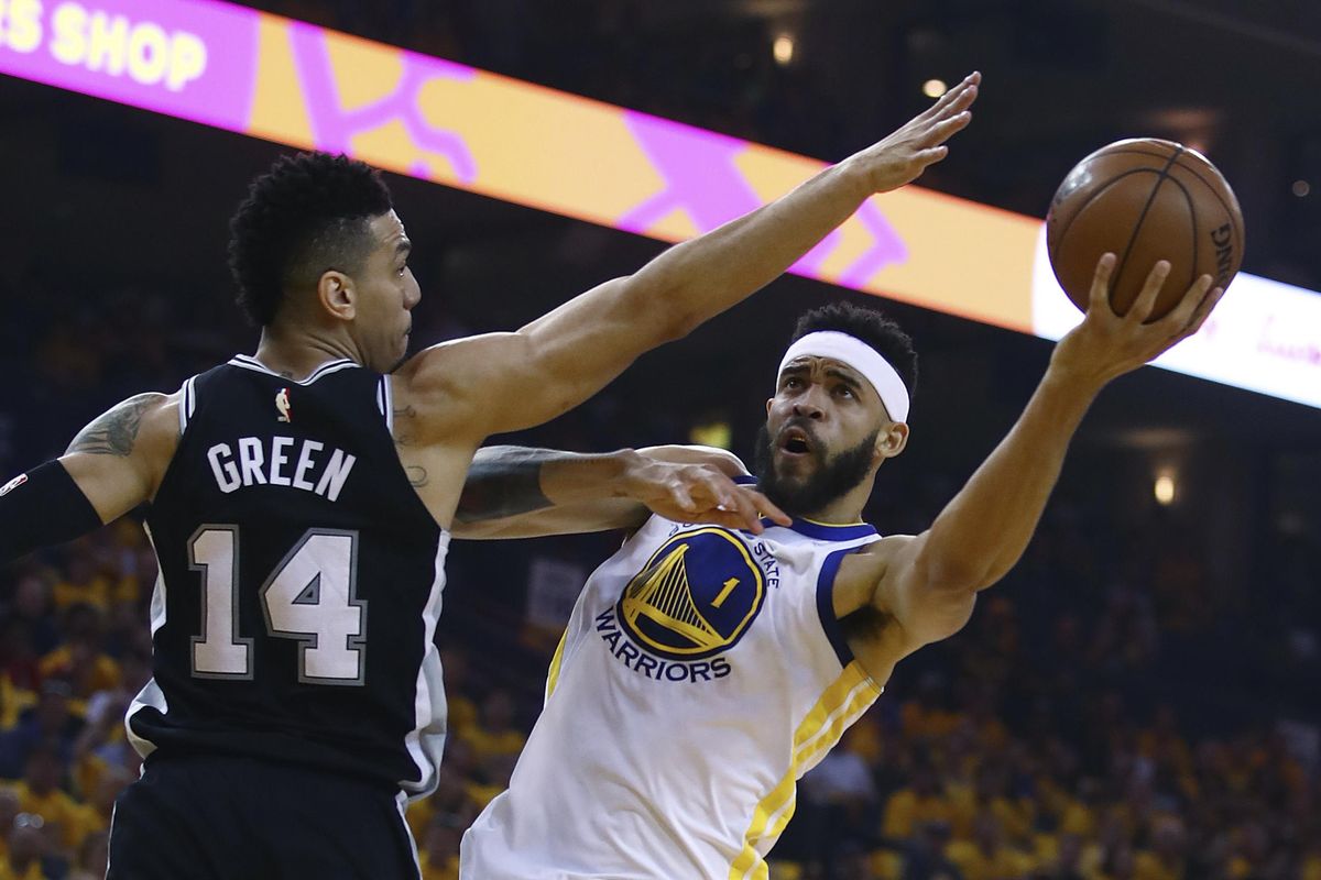 Golden State Warriors’ JaVale McGee, right, shoots over San Antonio Spurs’ Danny Green (14) during the first half in Game 1 of a first-round NBA basketball playoff series Saturday, April 14, 2018, in Oakland, Calif. (Ben Margot / Associated Press)