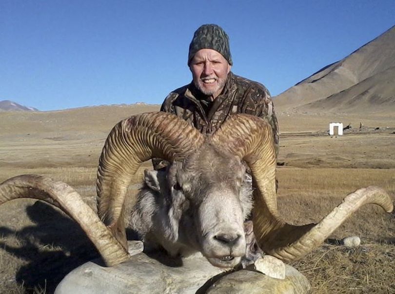 Rick Vukasin poses with a rare argali sheep known as the “Marco Polo” that he shot in the mountains of northeast Tajikistan along the Chinese border in December 2012. (Associated Press)