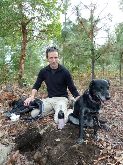 Winemaker Eric Weisinger poses last week with a bottle of 2002 Petite Pompadour he’d buried in March 2006 on a hill above his family’s Ashland, Ore., vineyard. (Associated Press)