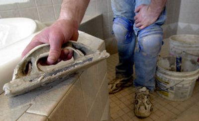 
Minimal water damage can cause the plywood underlayment to swell, making it difficult or even impossible to place new tiles evenly. Once the underlying floor is healthy, the bathroom tiles can be replaced.
 (File Photo / The Spokesman-Review)