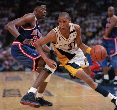 Pacers' Reggie Miller, right, slips past Knicks’ Patrick Ewing in the 1994 playoffs when the two teams had a heated rivalry. (Associated Press)