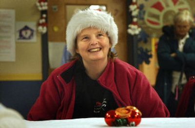 
Carol Crigger of Bernadette's Place smiles Thursday as festivities for the organization's Christmas party gets under way. Bernadette's Place is  a living facility for developmentally disabled women. 
 (Brian Plonka / The Spokesman-Review)