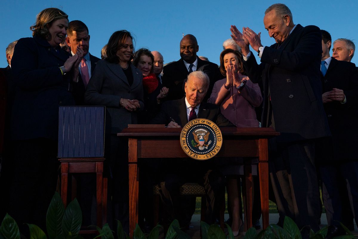 FILE - President Joe Biden signs the "Infrastructure Investment and Jobs Act" during an event on the South Lawn of the White House, Nov. 15, 2021, in Washington. Biden will deliver his State of the Union address to a joint session of Congress on Tuesday, March 1, 2022.  (Evan Vucci)