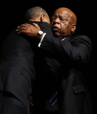 U.S. Rep. John Lewis, right, hugs President Barack Obama after Obama’s speech during the Civil Rights Summit in Austin, Texas, on Thursday. (Associated Press)