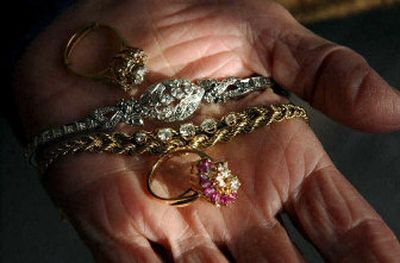 
Rosemary Campo holds some rings from her flooded New Orleans home that were salvaged  and cleaned. 
 (The Spokesman-Review)