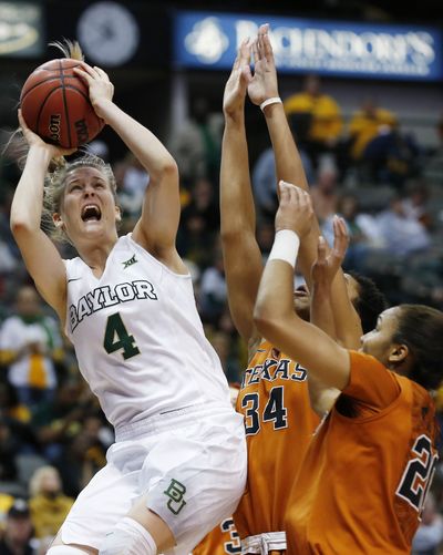 Baylor’s Kristy Wallace attempts a shot over Brianna Taylor (20) and Imani McGee-Stafford (34) of Texas in Big 12 title game. (Associated Press)