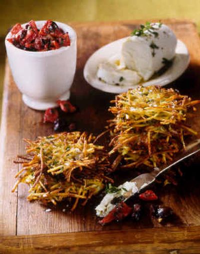 
Provencal Potato Latkes with Roasted Red Pepper Relish is a dish with a difference for the Hanukkah menu. The creaminess of the melting goat's cheese and the brininess of the olive complement the olive oil that the latkes are fried in. 
 (Associated Press/Abigael's at the Museum / The Spokesman-Review)