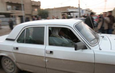 
Two of the five women released Thursday by U.S. authorities from a detention center, sitting in the back seat, are driven to their homes in Baghdad. 
 (Associated Press / The Spokesman-Review)