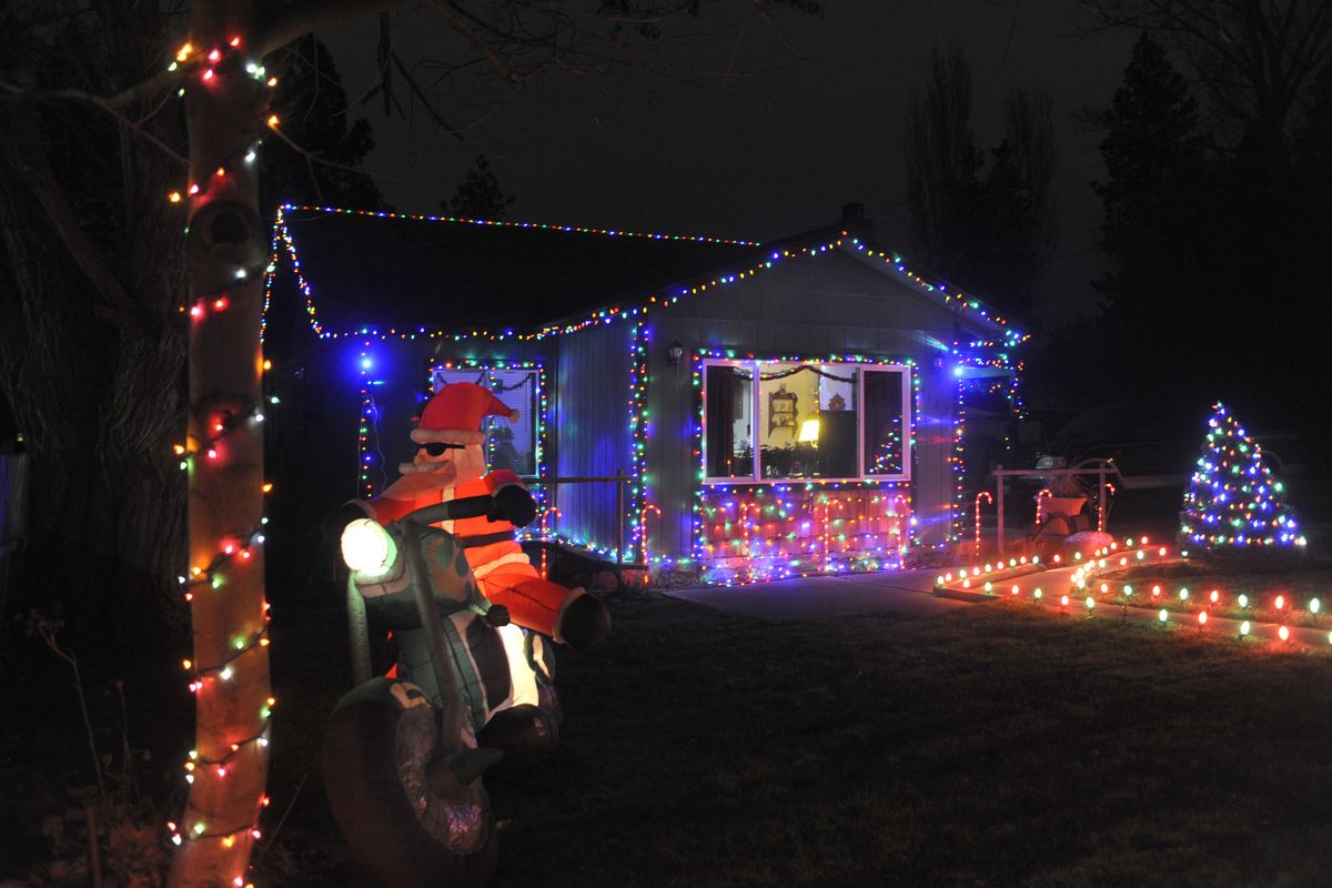 A Santa on a chopper is part of the display at 4138 E. 12th Ave. on Spokane’s South Hill. (Jesse Tinsley)