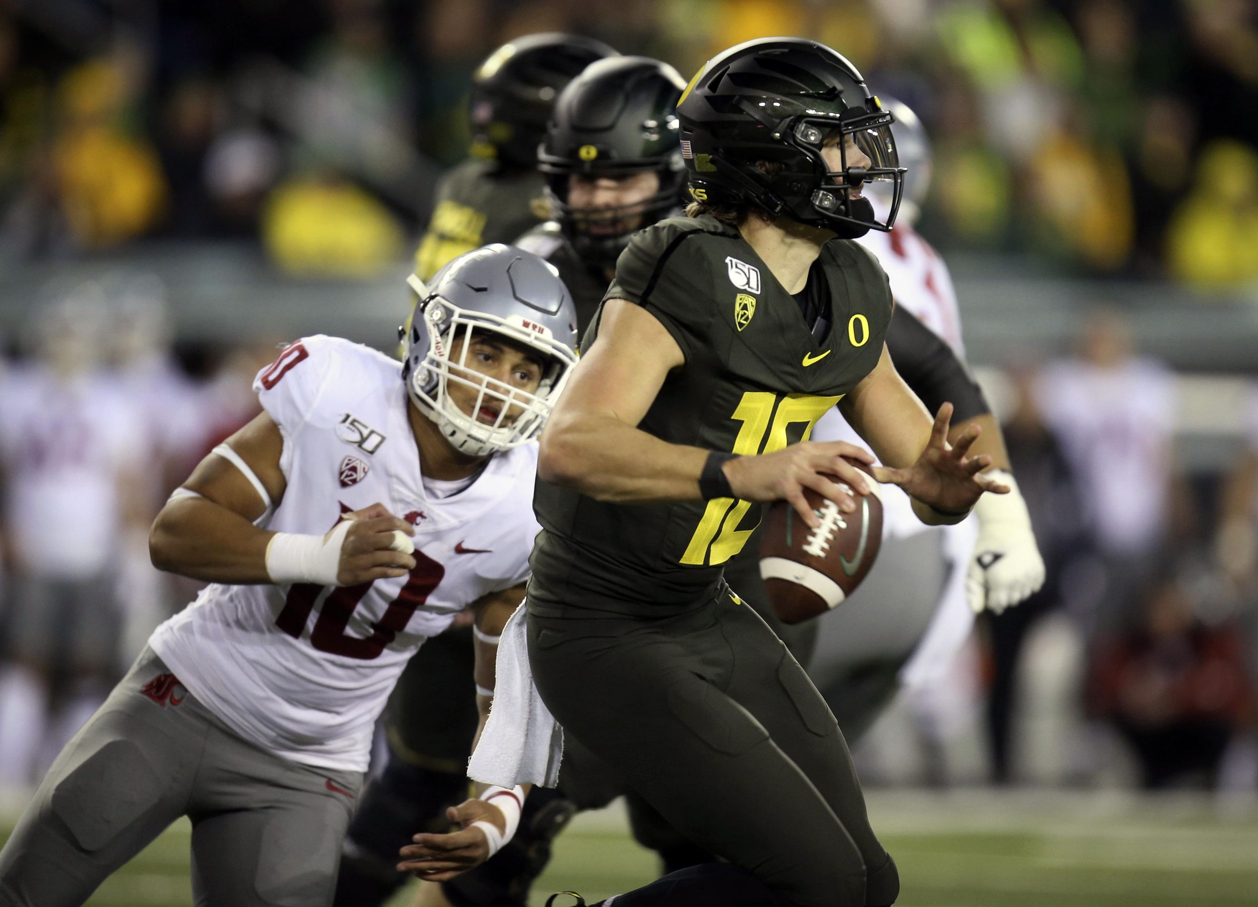 Justin Herbert serves as steadying force as Oregon cruises to opening win -  The Athletic