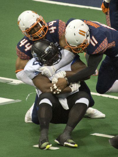 Spokane Shock defensive lineman James Ruffin, top, leads the AFL in sacks with 14 1/2. (Dan Pelle)