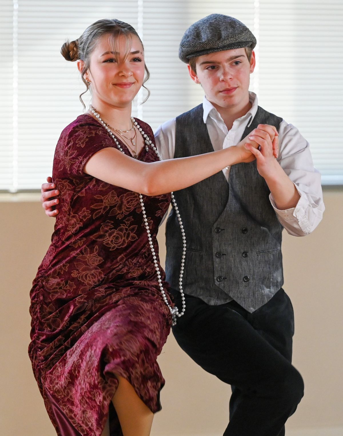 Rosamond Grim, 16, and Lowell Geottert, 15, perform the black bottom, a 1920s swing dance during rehearsals Tuesday, April 9, 2024 at the Silver Spurs rehearsal studio in Spokane, Washington. The population of the longstanding dance troupe, which performed at Expo ‘74 50 years ago, has taken a hit during the COVID era. The program teaches kids a variety of ethnic and recreational dances.  (Jesse Tinsley/The Spokesman-Review)