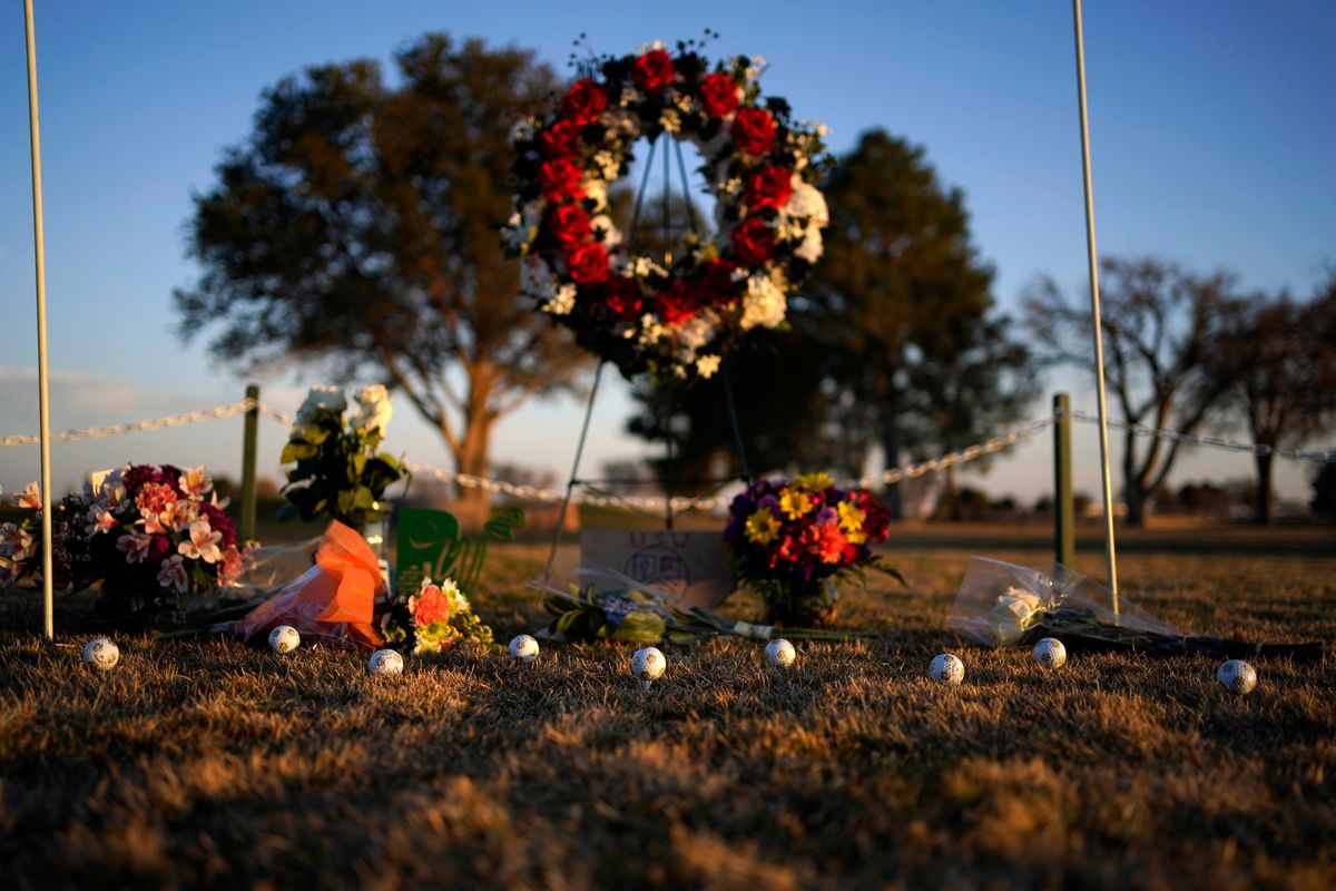 Golf balls adorn a makeshift memorial at the Rockwind Community Links, Wednesday, March 16, 2022, in Hobbs, New Mexico. The memorial was for student golfers and the coach of University of the Southwest killed in a crash in Texas.  (John Locher)