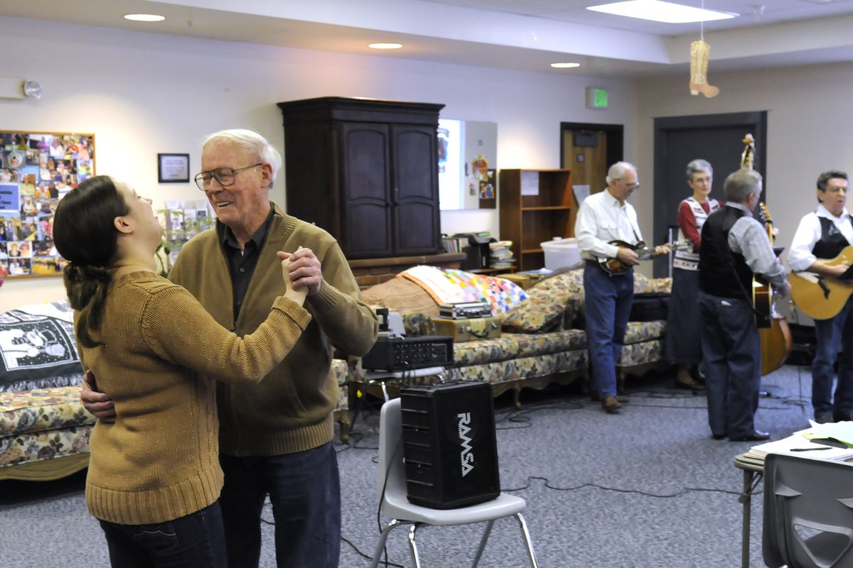 Paul McCall dances with Senior Center employee Rebecca Judd while Just Friends, the bluegrass group from Project Joy, plays “The Green Green Grass of Home”  at the East Central Community Center recently.jesset@spokesman.com (Jesse Tinsley)