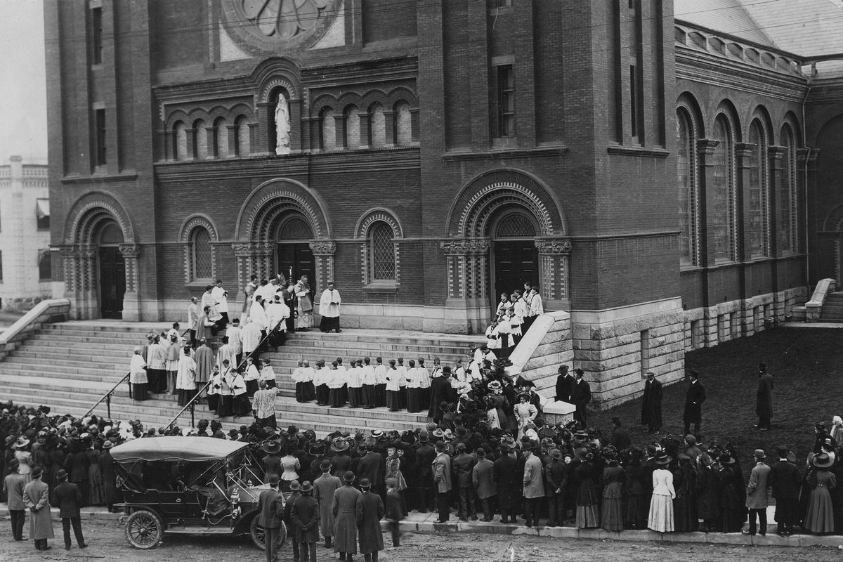 1908: People line the street for the dedication of Our Lady of Lourdes Catholic Church on Riverside Avenue on Thanksgiving Day.