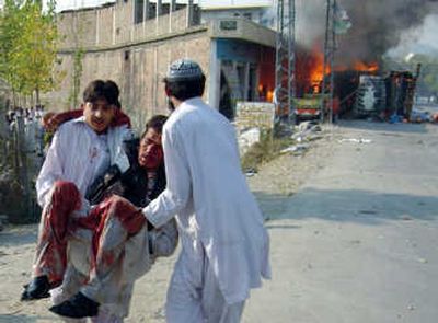 
Pakistani volunteers remove an injured man from the site of suicide bombing Thursday in Mingora, the main town of the Swat district of Pakistan's North West Frontier province. Associated Press
 (Associated Press / The Spokesman-Review)