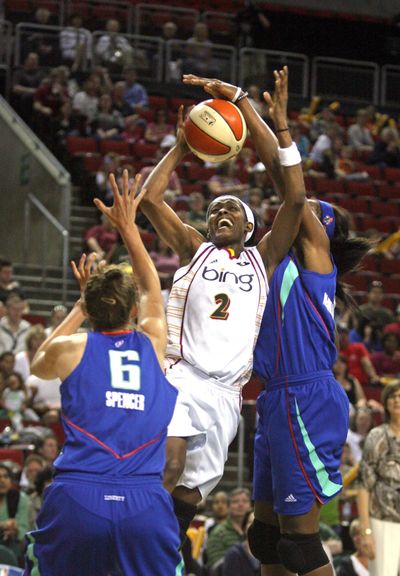 Seattle’s Swin Cash, center, led all players with 20 points.  (Associated Press)