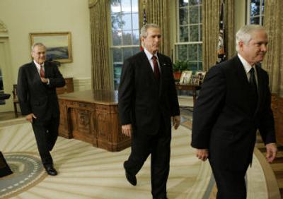 
President Bush, center, walks out of the Oval Office on Wednesday with outgoing Defense Secretary Donald Rumsfeld, left, and  former CIA Director Robert Gates. 
 (Associated Press / The Spokesman-Review)