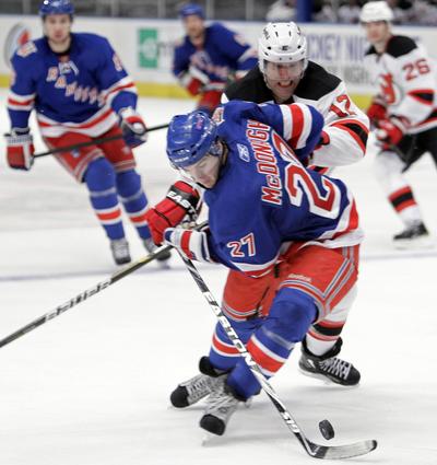 New York's Ryan McDonagh notched his first NHL goal as the Rangers earned a playoff spot after topping New Jersey. (Associated Press)